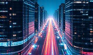 Cityscape at dusk with connected smart technology highlights